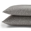 Tiny light grey blossoms and stems adorn these soft, nature-inspired sheets by Calvin Klein Home.