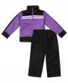 Keep her comfy no matter how much she's moving in this sporty track jacket and pant set from Nike.