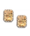 Add a glamorous touch. This pair of 10k gold earrings sparkles with emerald-cut citrine (2-1/2 ct. t.w.) and diamond accents for a stunning effect. Approximate drop: 3/8 inch.