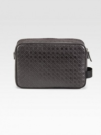 An essential travel companion constructed for a lifetime of use in fine, gancio-embossed leather. Zip closure Side handle 9¾W X 6¾H X 3D Made in Italy An essential travel companion constructed for a lifetime of use in fine, gancio-embossed leather. Zip closure Side handle 9¾W X 6¾H X 3D Made in Italy