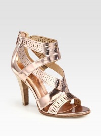 Shimmery metallic leather stunner with allover perforations and an exposed back zipper. Stacked heel, 3½ (90mm)Metallic leather upperBack zipperLeather lining and solePadded insoleImportedOUR FIT MODEL RECOMMENDS ordering one half size up as this style runs small. Shimmery metallic leather stunner with allover perforations and an exposed back zipper. Stacked heel, 3½ (90mm)Metallic leather upperBack zipperLeather lining and solePadded insoleImportedOUR FIT MODEL RECOMMENDS ordering one half size up as this style runs small.