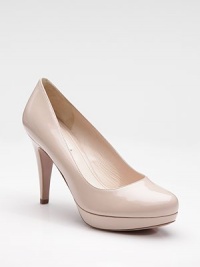 Patent leather platform pump with rounded toe.Self-covered heel, 4 Self-covered platform, ¾ Compares to a 3¼ heel Leather lining and sole Padded insole Made in ItalyOUR FIT MODEL RECOMMENDS ordering true size. Patent leather platform pump with rounded toe.Self-covered heel, 4 Self-covered platform, ¾ Compares to a 3¼ heel Leather lining and sole Padded insole Made in ItalyOUR FIT MODEL RECOMMENDS ordering true size.