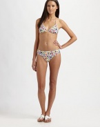 A fun, abstract print is always a viable swim option when catching rays.Halter strap ties at neckBack tie closureStretch bottom76% nylon/24% spandexHand washMade in USA of Italian fabric