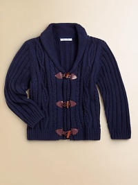 A grown-up classic warms your little guy with the sophisticatred style of rich cables and ribbing, plus a handsome toggle front.Shawl collarToggle front closeFront cablesLong ribbed sleevesRibbed backRibbed bottomCotton/acrylicMachine washImported Please note: Number of toggles may vary depending on size ordered. A grown-up classic warms your little guy with the sophisticatred style of rich cables and ribbing, plus a handsome toggle front.Shawl collarToggle front closeFront cablesLong ribbed sleevesRibbed backRibbed bottomCotton/acrylicMachine washImported Please note: Number of toggles may vary depending on size ordered.