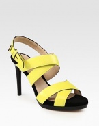 Wide leather criss-cross straps complemented by an adjustable slingback. Stacked heel, 4 (100mm)Leather upperLeather and suede liningLeather solePadded insoleMade in Italy