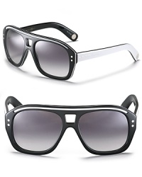 Retro-inspired shield sunglasses with contrast arms and a sporty racing stripe along top of frames. Retro-inspired shield sunglasses with contrast arms and a sporty racing stripe along top of frames.