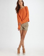 Oversized boatneck with a slightly curved hem and dab of cashmere. BoatneckLong sleeves40% rayon/30% nylon/25% acrylic/5% cashmereDry cleanImported