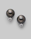 From the South Sea Collection. Classic black cultured pearl studs with sparkling diamond accents, set in 18k gold. 8mm black round cultured pearls Quality: A+ Diamonds, 0.20 tcw 18k white gold Post back Imported