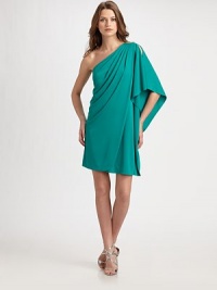 Soft, sculptural pleats and an asymmetrical silhouette bring drama to this artfully draped design.Asymmetrical necklineSingle split cape sleevePleated shoulder detailsSide drapeConcealed side zipFully linedAbout 22 from natural waistRayonDry cleanImportedModel shown is 5'10 (177cm) wearing US size Small. Soft, sculptural pleats and an asymmetrical silhouette bring drama to this artfully draped design.Asymmetrical necklineSingle split cape sleevePleated shoulder detailsSide drapeConcealed side zipFully linedAbout 22 from natural waistRayonDry cleanImportedModel shown is 5'10 (177cm) wearing US size Small.