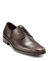 Square toe dress shoe with lace up front with top stitching detailing on front, rubber heel, slightly stacked.