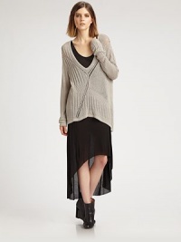 An oversized knit that doesn't lose its femininity, thanks to a creative open back and chic high-low hem.Plunging v-neckLong sleevesHigh-low hemCrossover detail on open backAbout 34 from shoulder to hem65% viscose/35% polyesterDry cleanImported of Italian fabricModel shown is 5'10 (177cm) wearing US size Small. An oversized knit that doesn't lose its femininity, thanks to a creative open back and chic high-low hem.Plunging v-neckLong sleevesHigh-low hemCrossover detail on open backAbout 34 from shoulder to hem65% viscose/35% polyesterDry cleanImported of Italian fabricModel shown is 5'10 (177cm) wearing US size Small.