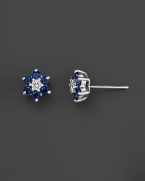 Diamonds and sapphires in a 14K white gold floral setting.
