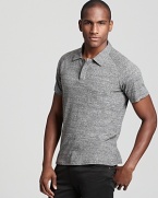 A charcoal gray cotton polo from Theory gets downtown-inspired styling with hidden front buttons and a slim fit.