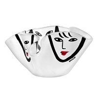 Designed by Swedish glass artist Ulrica Hydman-Vallien, this sculptural crystal bowl from Kosta Boda features hand-painted profiles outlined in dramatic black brushstrokes. Designed by Swedish glass artist Ulrica Hydman-Vallien, this sculptural crystal bowl from Kosta Boda features hand-painted profiles outlined in dramatic black brushstrokes.