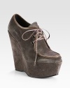 Smooth leather trim lines this lace-up suede design, elevated by a tall platform wedge. Self-covered wedge, 5¾ (145mm)Covered platform, 2 (50mm)Compares to a 3¾ heel (95mm)Suede upper with leather trimLeather liningRubber solePadded insoleImported