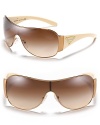 Shield sunglasses with signature triangle logo at temples from Prada make the perfect staple for the season.