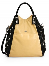 THE LOOKRemovable flat leather crossbody strapDouble tubular leather top handles with whipstitchingNickel cone studs dot the side panelsMagnetic snap closureFront metal logo detailOne outside open pocketOne inside zip pocketTwo inside open pocketsInside logo detailTHE MEASUREMENTCrossbody strap, 19 drop18W X 14H X 4DTHE MATERIALLeatherUltra suede liningORIGINMade in USA THE LOOKRemovable flat leather crossbody strapDouble tubular leather top handles with whipstitchingNickel cone studs dot the side panelsMagnetic snap closureFront metal logo detailOne outside open pocketOne inside zip pocketTwo inside open pocketsInside logo detailTHE MEASUREMENTCrossbody strap, 19 drop18W X 14H X 4DTHE MATERIALLeatherUltra suede liningORIGINMade in USA