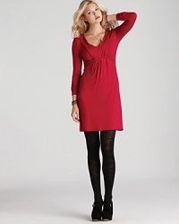 A flattering v neckline and empire waist lend eye-catching allure to the body-skimming silhouette of this Three Dots dress. A flattering v neckline and empire waist lend eye-catching allure to the body-skimming silhouette of this Three Dots dress.