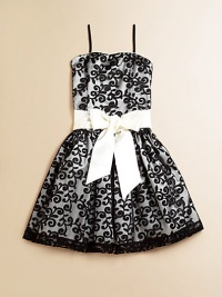 She'll be simply stunning in this lace frock with a princess-like full skirt and fancy ribbon tie.Straight necklineSpaghetti strapsBack zipperWaistband with ribbon tieFull skirtPolyesterDry cleanImported of domestic fabric She'll be simply stunning in this lace frock with a princess-like full skirt and fancy ribbon tie.Straight necklineSpaghetti strapsBack zipperWaistband with ribbon tieFull skirtPolyesterDry cleanImported of domestic fabric