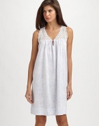 A back pleat and lace yoke embellishment add definition to a classic chemise.