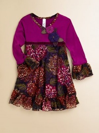 A lacy, vintage-inspired frock in a faux wrap silhouette with velvet trim and a deeply hued floral print for the budding fashionista in your life.V-neckLong bell sleevesPullover styleVelvet belted waistRuffled hemLined skirtBodice: 95% rayon/5% spandexSkirt: 95% polyester/5% spandexHand washMade in the USA of imported fabric A lacy, vintage-inspired frock in a faux wrap silhouette with velvet trim and a deeply hued floral print for the budding fashionista in your life.V-neckLong bell sleevesPullover styleVelvet belted waistRuffled hemLined skirtBodice: 95% rayon/5% spandexSkirt: 95% polyester/5% spandexHand washMade in the USA of imported fabric