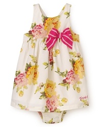 Juicy Couture's lovely poplin dress is rendered in large flower print, with ruffles from the empire waist and a big striped bow at the side. Juicy Couture's lovely poplin dress is rendered in large flower print, with ruffles from the empire waist and a big striped bow at the side.