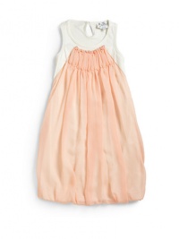 THE LOOKScoop neckFront chiffon ruffle detailSleevelessPullover styleFront bubble hemTHE MATERIALPolyesterSecond fabric: polyesterFully linedCARE & ORIGINDry cleanImported THE LOOKScoop neckFront chiffon ruffle detailSleevelessPullover styleFront bubble hemTHE MATERIALPolyesterSecond fabric: polyesterFully linedCARE & ORIGINDry cleanImported