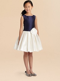 An outstanding floral embellishment adds pretty style to this slightly pleated, colorblocked frock.U-neckSleevelessConcealed back zipperWaistband with floral appliquéFull, pleated skirtFully linedPolyesterDry cleanMade in the USA of imported fabric An outstanding floral embellishment adds pretty style to this slightly pleated, colorblocked frock.U-neckSleevelessConcealed back zipperWaistband with floral appliquéFull, pleated skirtFully linedPolyesterDry cleanMade in the USA of imported fabric