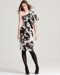 This Anne Klein New York dress exudes drama with a striking one-shoulder silhouette rendered in sumptuous silk and covered in a painterly tie-dye print. This Anne Klein New York dress exudes drama with a striking one-shoulder silhouette rendered in sumptuous silk and covered in a painterly tie-dye print.