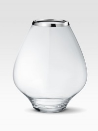 A masterful balance between strength and poetry, handcrafted in glass with a bulb-like shape that does justice to your most artful flower arrangements. From the Grace CollectionGlass with stainless steel rim10½H X 9 diam.Hand washImported A masterful balance between strength and poetry, handcrafted in glass with a bulb-like shape that does justice to your most artful flower arrangements. From the Grace CollectionGlass with stainless steel rim10½H X 9 diam.Hand washImported