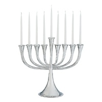 This eye-catching menorah is both traditional and modern. In the designer's own words, the Molten collection is distinguished by streamlined, timeless shapes... objects which reverberate with the skill of their maker and yet do not fit into a traditional interpretation of craft. The pieces possess a soulfulness and organic energy only possible through the handmade process. This eye-catching menorah is both traditional and modern. In the designer's own words, the Molten collection is distinguished by streamlined, timeless shapes... objects which reverberate with the skill of their maker and yet do not fit into a traditional interpretation of craft. The pieces possess a soulfulness and organic energy only possible through the handmade process.