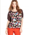 In contrasting mixed prints, this RACHEL Rachel Roy top is perfect for adding a modern edge to your fall look!
