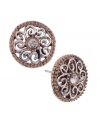 Complete your whole look with a pair of sparkling studs. Perfect for day or night, these 2028 earrings feature a unique, filigree, silver and rose gold tone mixed metal setting with a round-cut crystal center stone. Approximate diameter: 3/4 inch.