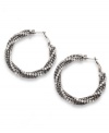 Definitely dazzling! Glittering glass accents and crystals dress up these gorgeous twisted hoop earrings from Alfani. Crafted in hematite tone mixed metal, they'll add a glamorous element to even the most casual outfit. Approximate diameter: 2 inches.