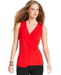 A sleeveless wrap top from Calvin Klein embodies modern allure with its plunging surplice neckline and shimmering metal hardware. Try it with pants or a skirt and add understated jewelry for a look that transitions seamlessly from work to weekend. A sleeveless wrap top from Calvin Klein embodies modern allure with its plunging surplice neckline and shimmering metal hardware. Try it with pants or a skirt and add understated jewelry for a look that transitions seamlessly from work to weekend.