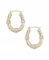 Notched accents give these hoop earrings a segmented look. Set in 14k white and yellow gold.