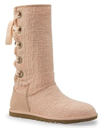 In a textured cotton weave, the UGG® Australia Heirloom boots offer superior warmth and comfort with a feminine finish. In a textured cotton weave, the UGG® Australia Heirloom boots offer superior warmth and comfort with a feminine finish.