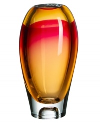 Like a blazing sunset over the tropics, this Vision vase from Kosta Boda brightens a room in an eye-catching combination of amber and pink. Luxuriously crafted art glass flows in a smooth, elliptical shape to emphasize the striking palette. Like a blazing sunset over the tropics, this Vision vase from Kosta Boda brightens a room in an eye-catching combination of amber and pink. Luxuriously crafted art glass flows in a smooth, elliptical shape to emphasize the striking palette.