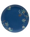 Flower power. Featuring delicate blooms on ultra-durable porcelain, this Veronica salad plate accents the table with smart style. A royal-blue ground with coordinating florals adds striking contrast to the cream-colored place setting.