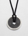 From the Classic Chain Collection. The center of this striking pendant has the look of an ancient coin with its square hole and blackened finish, set in a distinctive carved setting of polished sterling silver and hanging from a black cord.Sterling silverBlack fabric cordCord length, about 22 to 24 (adjustable)Pendant diameter, about 1.75Lobster claspMade in Bali