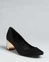 Elegant evening pumps are enlivened with boldly metallic heels studded with striking rhinestone details. Get set to shine.
