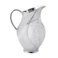 Shaped by hand of durable recycled aluminum, this striking pitcher from Mariposa is detailed with a softly textured finish and beaded edges for a look that's at once organic and refined. Shaped by hand of durable recycled aluminum, this striking pitcher from Mariposa is detailed with a softly textured finish and beaded edges for a look that's at once organic and refined.