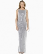 Capturing timeless elegance in a sweeping floor-length silhouette, the evening gown is tailored with a sequined mesh overlay and a sexy cowled back for an alluring finish.