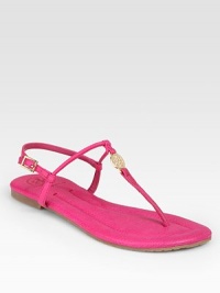 Crafted with an adjustable slingback strap and a rubber sole, this pebbled leather flat has a goldtone designer emblem and classic thong front. Leather upperLeather liningRubber solePadded insoleImportedOUR FIT MODEL RECOMMENDS ordering true size. Crafted with an adjustable slingback strap and a rubber sole, this pebbled leather flat has a goldtone designer emblem and classic thong front. Leather upperLeather liningRubber solePadded insoleImportedOUR FIT MODEL RECOMMENDS ordering true size.