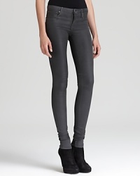 These Helmut Lang skinny jeans boast a coated glossy wash for subtle sheen, streamlining themselves with these season's glamour trend. These Helmut Lang skinny jeans boast a coated glossy wash for subtle sheen, streamlining themselves with these season's glamour trend.