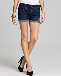 A roll-up hem and dark wash make these AG Adriano Goldschmied denim shorts the ideal pair for summer. A roll-up hem and dark wash make these AG Adriano Goldschmied denim shorts the ideal pair for summer.