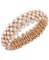 Slip on some blush tones that add life to any look. Charter Club's chic beaded style features clear glass accents in rose gold tone mixed metal. Bracelet stretches to fit wrist. Approximate diameter: 2-1/4 inches.