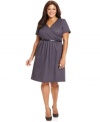 A flattering A-line shape elegantly defines NY Collection's short sleeve plus size dress, accented by a belted waist.