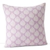 A bold tree print and stitched seams accent this lavender decorative pillow.