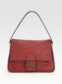 A simply chic leather design with signature hardware.Shoulder strap, 8 dropMagnetic snap flap closureOne inside zip pocketFully lined14W X 10H X 5½DMade in Italy A simply chic leather design with signature hardware.Shoulder strap, 8 dropMagnetic snap flap closureOne inside zip pocketFully lined14W X 10H X 5½DMade in Italy